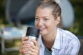 woman enjoying coffee from insulated cup while camping Royalty Free Stock Photo