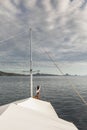 Woman enjoying cruise on luxury white yacht. Wealth and freedom travel concept Royalty Free Stock Photo