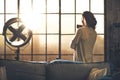 Woman enjoying cup of coffee in loft apartment Royalty Free Stock Photo