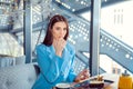 Woman enjoying dessert cake while sitting in cafe Royalty Free Stock Photo