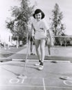 Woman enjoying a game of shuffleboard