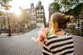 Woman with tulips in Amsterdam city Royalty Free Stock Photo