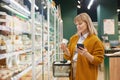 Woman enjoying grocery shopping