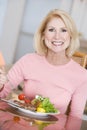 Woman Enjoying Healthy meal, mealtime Royalty Free Stock Photo