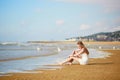 Woman enjoying her vacation by ocean or sea Royalty Free Stock Photo