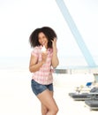 Woman enjoying ice cream at the beach