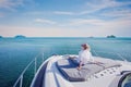 Woman enjoying luxurious yacht cruise, sea travel by luxury boat Royalty Free Stock Photo