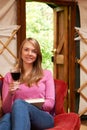 Woman Enjoying Luxury Camping Holiday In Yurt Royalty Free Stock Photo