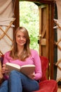 Woman Enjoying Luxury Camping Holiday In Yurt Royalty Free Stock Photo