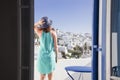 woman enjoying mykonos town view from terrace, Greece - summer holiday Royalty Free Stock Photo