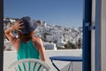 woman enjoying mykonos town view from terrace, Greece - summer holiday Royalty Free Stock Photo