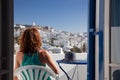 woman enjoying mykonos town view from terrace, Greece - summer holiday Royalty Free Stock Photo