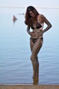 Woman enjoying the natural mineral mud sourced from the Dead Sea Royalty Free Stock Photo