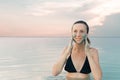 Woman enjoying the natural mud mineral source on dead sea background Royalty Free Stock Photo