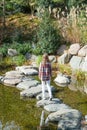 Woman enjoying nature walking in Japanese Garden