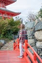 Woman enjoying nature walking in Japanese Garden