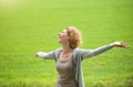 Woman enjoying the outdoors with arms spread open Royalty Free Stock Photo