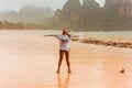 Woman enjoying rainy fall tropical beach Thailand Royalty Free Stock Photo