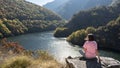 Woman enjoying scenic view of mountain in Rhodope mountains, Bulgaria. Nature getaway, travel, vacation outdoor, hiking