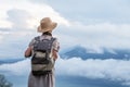 Woman enjoying sunrise from a top of mountain Batur, Bali, Indonesia Royalty Free Stock Photo