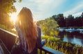 Woman enjoying the sunset over the Danube River in Regensburg Royalty Free Stock Photo