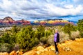 Woman enjoying the sunset over Thunder Mountain and other red rock mountains surrounding the town of Sedona, Arizona, USA Royalty Free Stock Photo