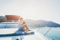 Woman enjoying sunset trip onboard of luxuious yacht, luxury sea cruise travel Royalty Free Stock Photo