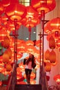 Woman enjoying traditional red lanterns decorated for Chinese new year Chunjie Royalty Free Stock Photo