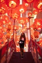 Woman enjoying traditional red lanterns decorated for Chinese new year Chunjie Royalty Free Stock Photo