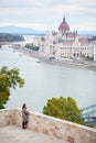 Woman is enjoying view Danube River, Parliament Building in Budapest Royalty Free Stock Photo