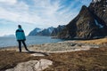 Woman enjoying the view in Lofoten on the island of Aa.