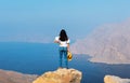 Woman enjoying view over Fjord Khor Najd in Oman Royalty Free Stock Photo
