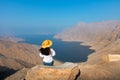 Woman enjoying view over Fjord Khor Najd in Oman