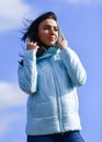 Woman enjoying weather outdoors. Freedom and expectation. Beauty and fashion, look. concept of loneliness. woman on blue