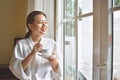 Woman enjoys fresh coffee in the morning