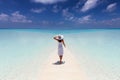 Woman enjoys her tropical vacation on a paradise beach Royalty Free Stock Photo