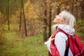 Woman enjoys hiking in wood Royalty Free Stock Photo