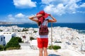 Woman enjoys the panoramic view to the town of Mykonos island, Cyclades, Greece Royalty Free Stock Photo