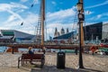 A woman enjoys the scene around the waters of the Canning Docks in Liverpool`s rennovated docklands Royalty Free Stock Photo