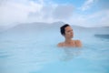 Woman enjoys spa in geothermal hot spring