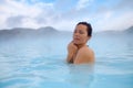 Woman enjoys spa in geothermal hot spring Royalty Free Stock Photo