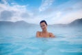 Woman enjoys spa in geothermal hot spring Royalty Free Stock Photo