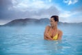 Woman enjoys spa in geothermal hot spring Royalty Free Stock Photo