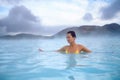 Woman enjoys spa in geothermal hot spring Royalty Free Stock Photo