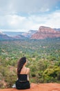 Woman enjoys the view of the Sedona landscape from the top of the Bell Rock hiking trail, famous for its many energy Royalty Free Stock Photo