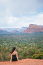 Woman enjoys the view of the Sedona landscape from the top of the Bell Rock hiking trail, famous for its many energy Royalty Free Stock Photo