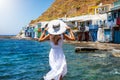 Woman enjoys the view to the fishing village of Klima on the Greek island of Milos Royalty Free Stock Photo