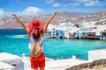 Woman enjoys the view to the Little Venice district at Mykonos town, Greece Royalty Free Stock Photo