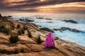 Woman enjoys views of sunbeams and sea flows