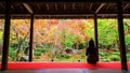 woman in Enkoji temple enjoys Autumn garden Royalty Free Stock Photo